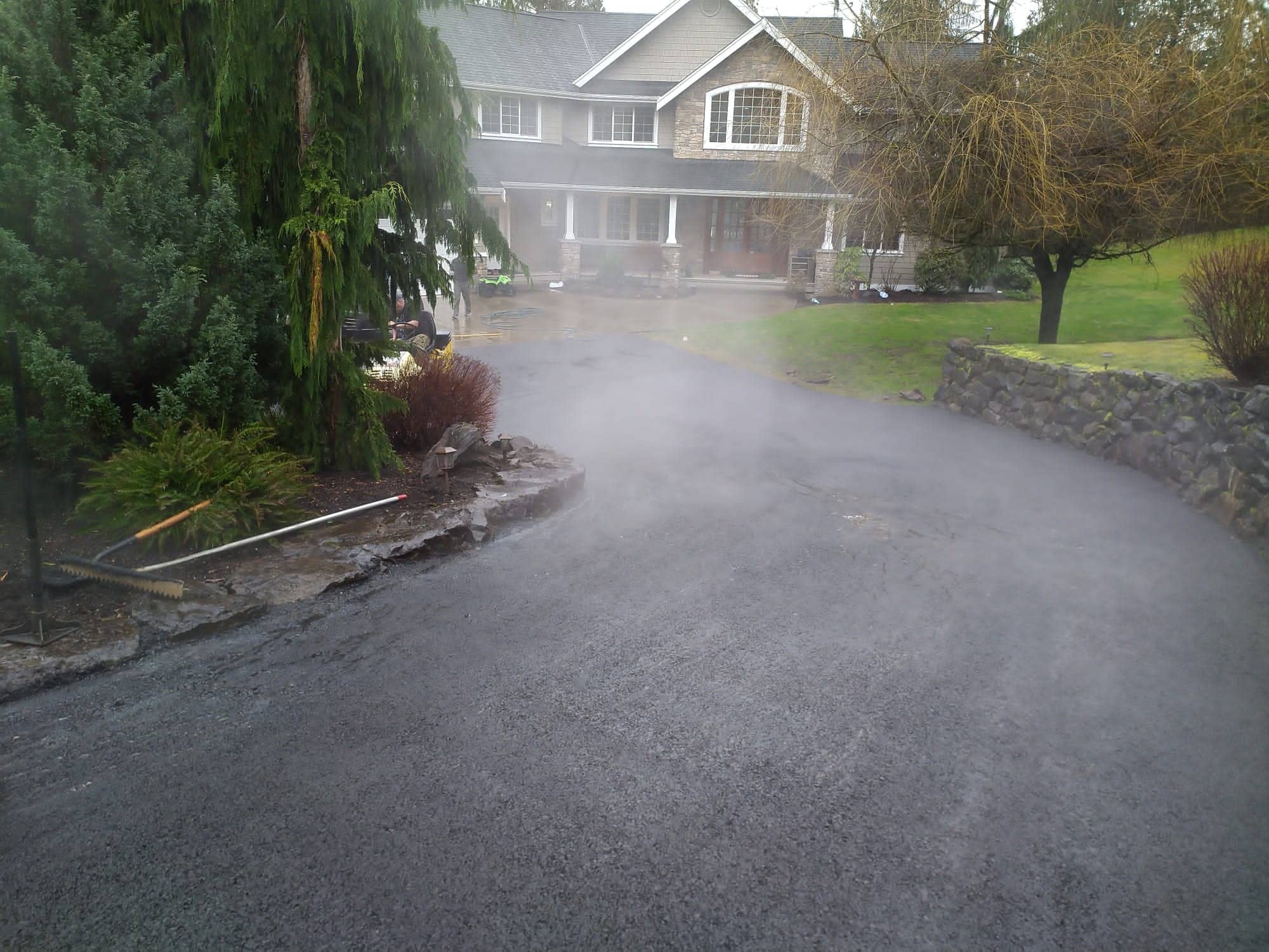 Steaming fresh asphalt on an estate driveway