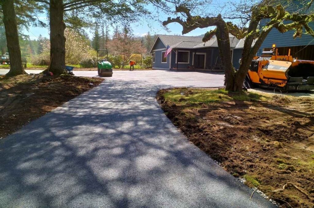 Residential asphalt driveway being finished